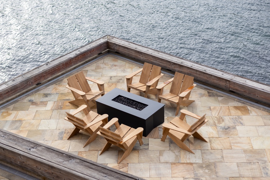 Gather around your private fire pit on this waterfront deck, where Adirondack chairs invite evening conversations under the stars.