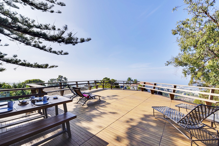 Relax on the extended deck and soak in the expansive landscape of the surrounding neighborhood, the Village, and the Pacific Ocean
