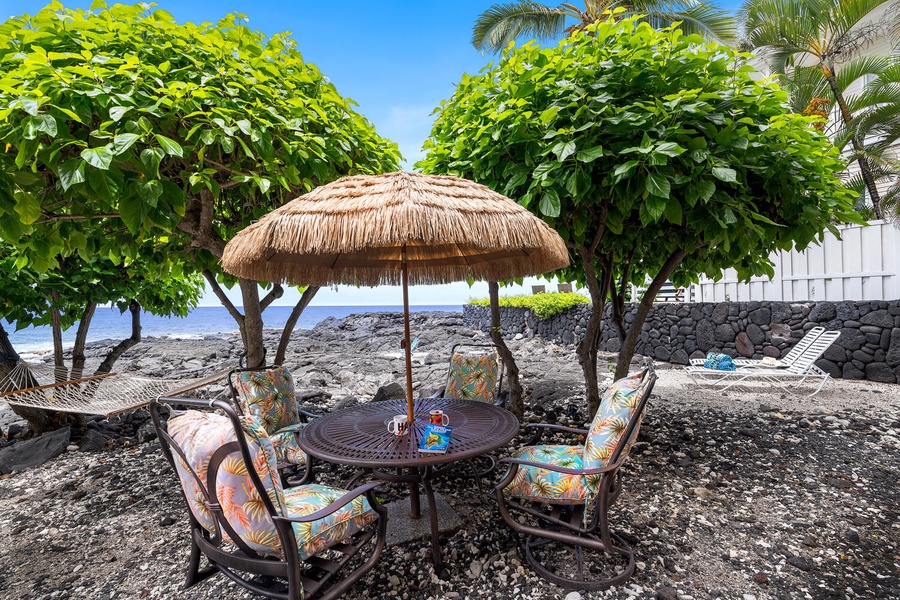 Claim this thatched table for morning malasadas or sunset charcuterie with the Pacific lapping at your feet—no reservation required.