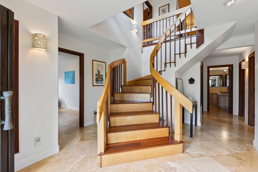 Stairs leading to the lower level guest rooms of the home.