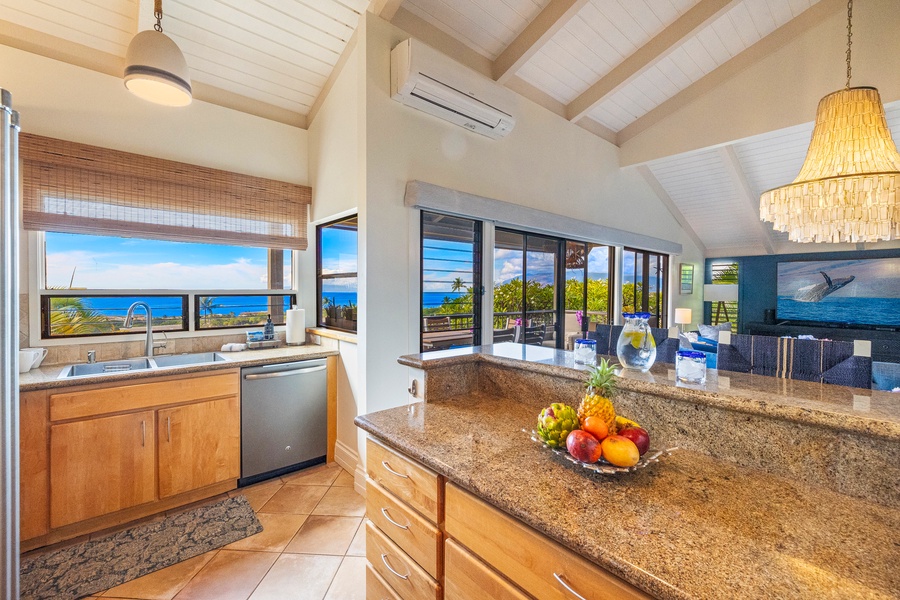 The fully equipped kitchen at Wailea Ekolu 1106 has ample counter space for meal prep.