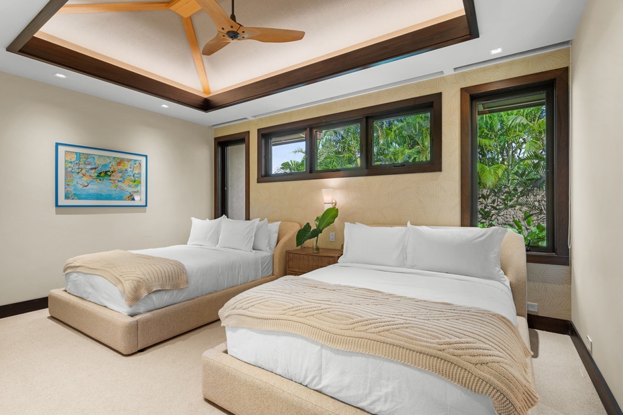 Guest Bedroom #3: Drift off in your tropical queen bedroom sanctuary, where plush beds and garden views create your perfect escape.