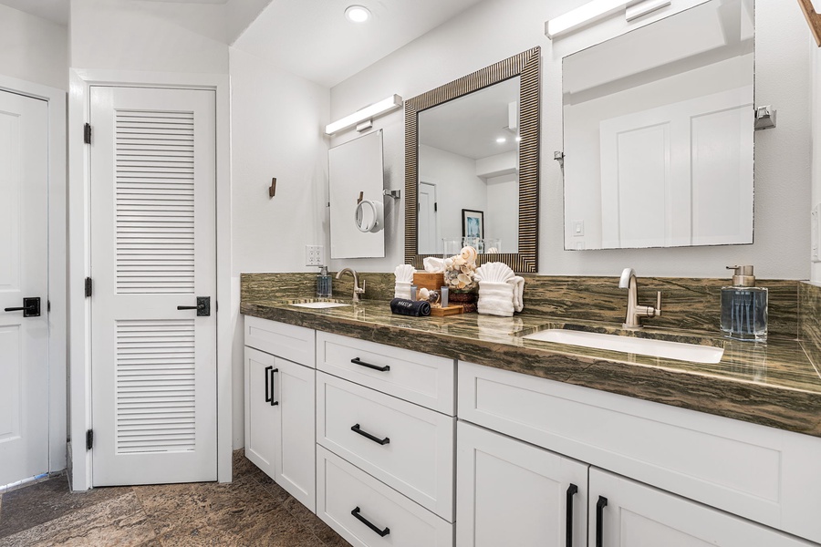 Start your day in a bright bathroom with dual vanities and a clean, modern feel.