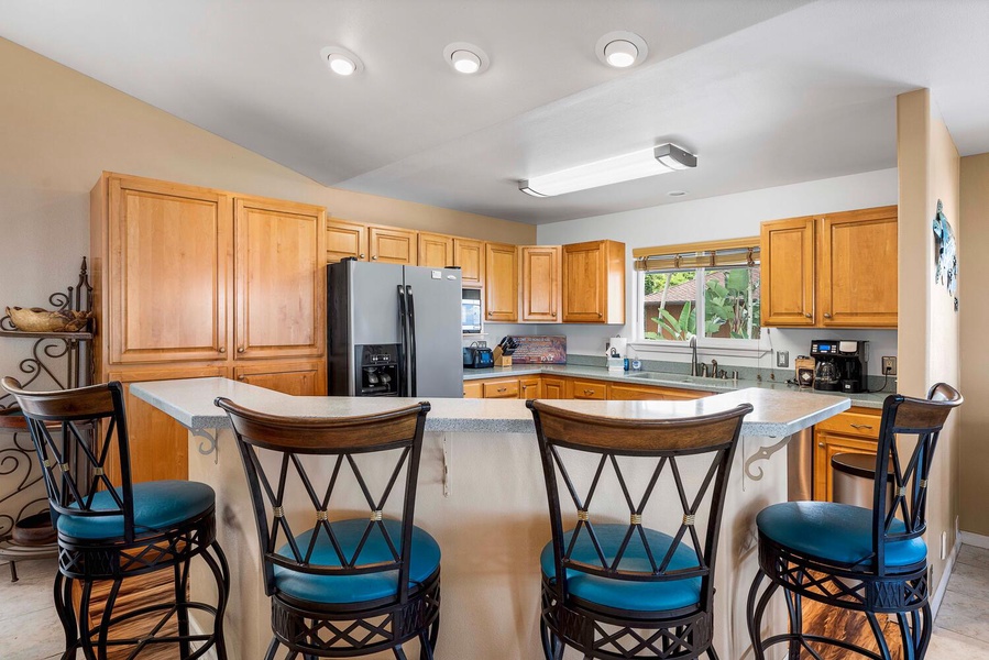 The kitchen features an island/bar for quick meals and entertainment.