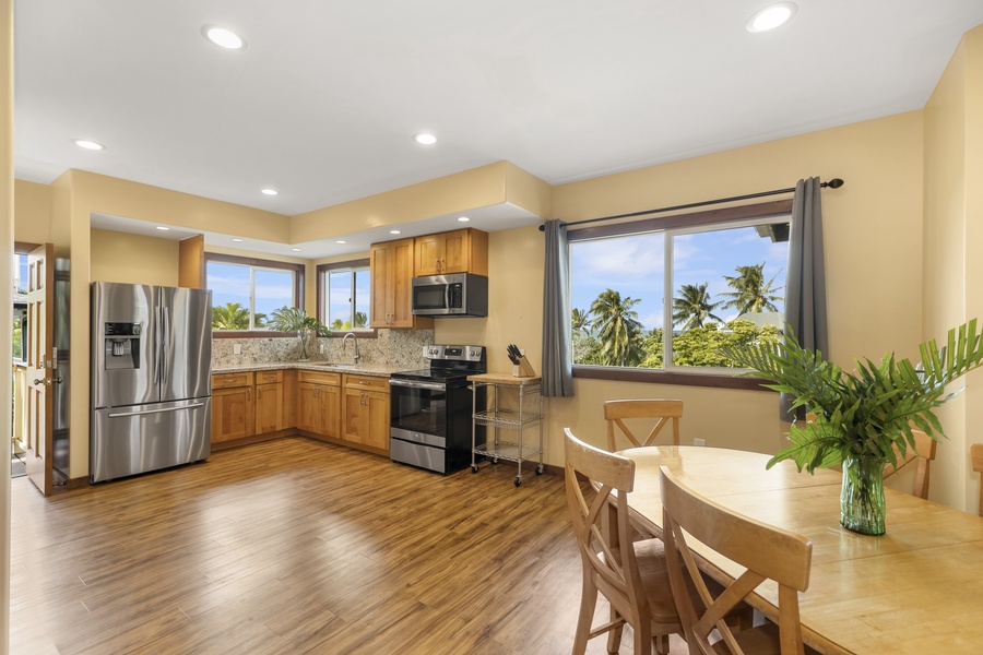The well-appointed upstairs kitchen features ocean views.