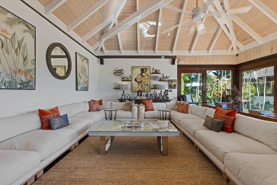 The spacious living room with comfortable seating.