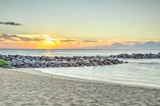 The magical sunsets and soft sands of Honu Lagoon.