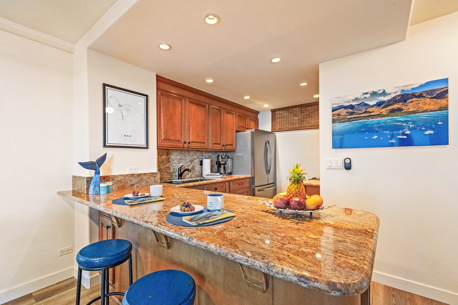 Spacious kitchen island with granite countertops, perfect for meal prep and entertaining.