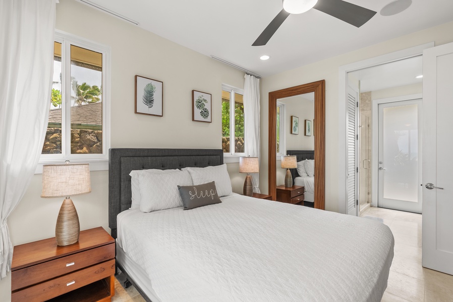 The lower-level bedroom has ensuite bathroom, split AC & ceiling fan.