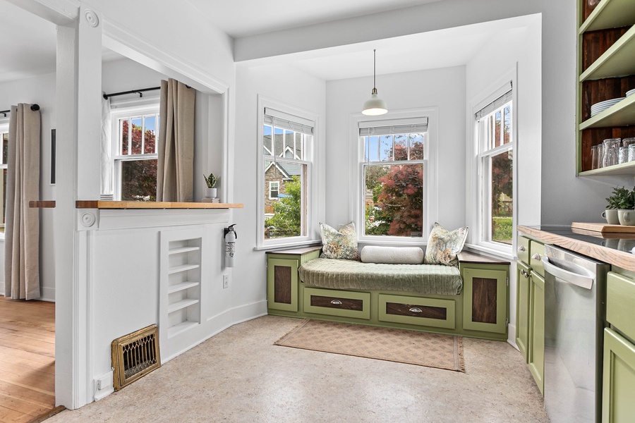 Surrounded by windows and natural light, this kitchen invites easy mornings and cozy nights in.