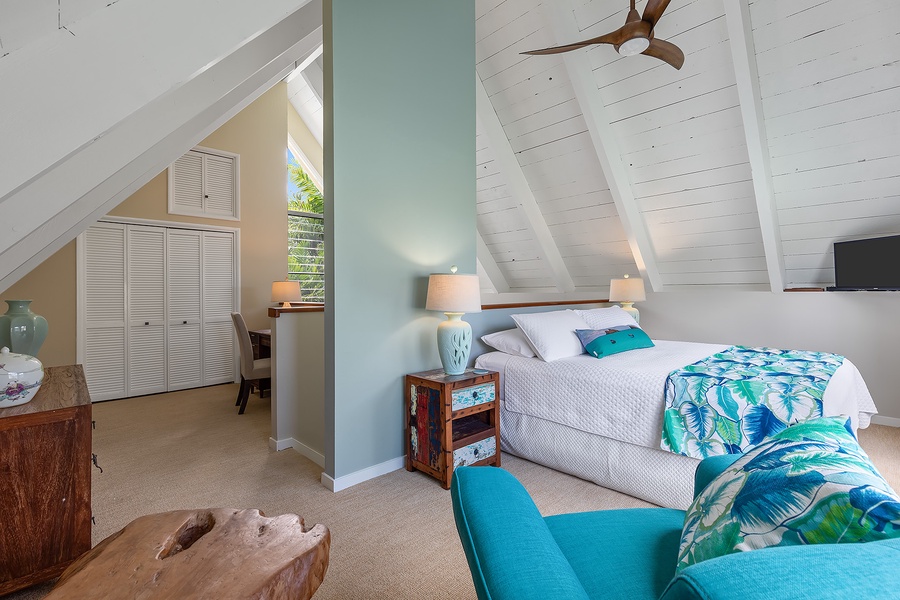 Pool house bedroom featuring a king-size bed and airy, coastal-inspired decor.