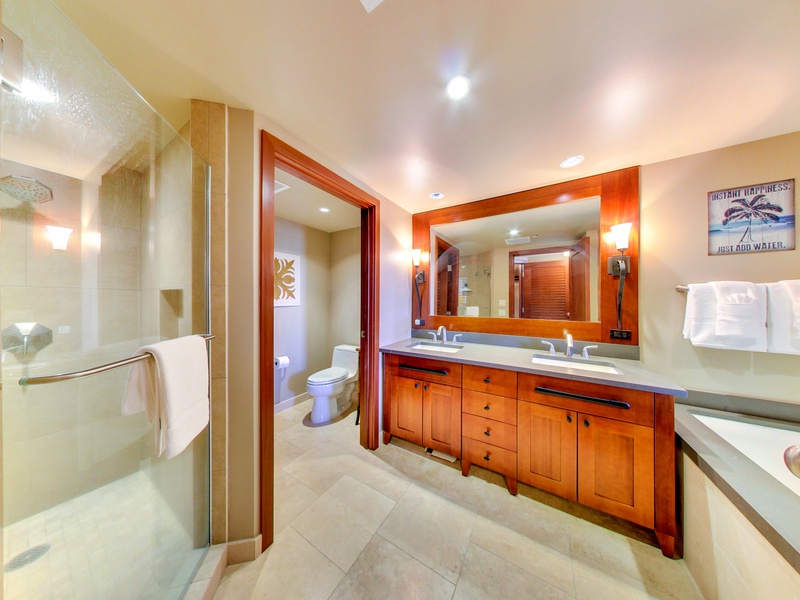 There are dual sinks in Ko Olina resort rental OT-1402 spacious primary bathroom.