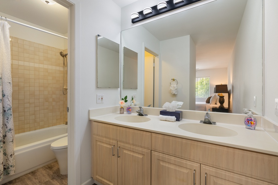 Your private bathroom features dual sinks and fresh towels, perfect for getting ready together.