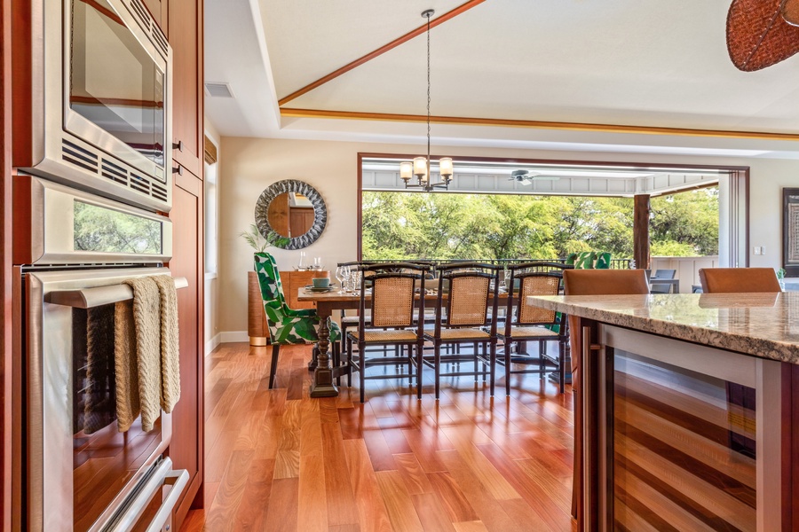 View of formal dining room and out to the upstairs terrace from the kitchen.