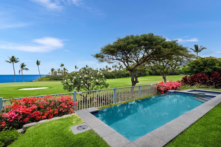 Beautiful poolside view overlooking a lush golf course.