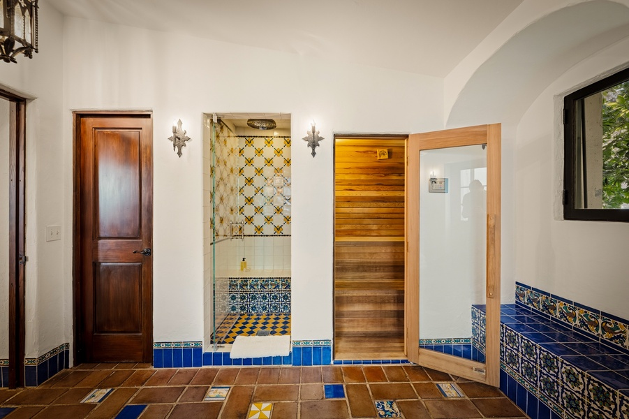 Relax in your private sauna after exploring colorful tilework throughout this charming space.