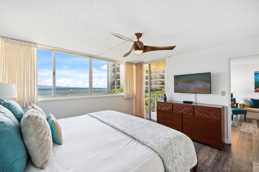 Step out to the lanai from Royal Kahana 308’s bedroom with king bed and flat-screen TV.