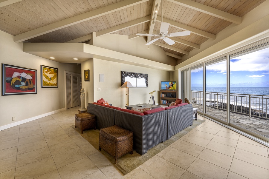 Whether you prefer to watch TV or take in the views, the living area offers comfort from every angle.