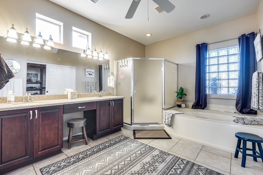 Expansive primary ensuite with a soaking tub, enclosed walk-in shower and a wide vanity space.