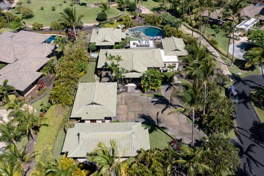 Spacious estate nestled among palm trees with plenty of open space and greenery.
