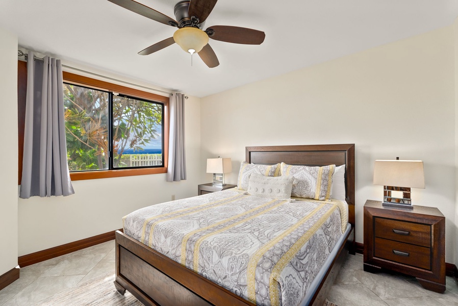 Serene guest house bedroom 1 with cozy king-sized bed and natural light streaming in.