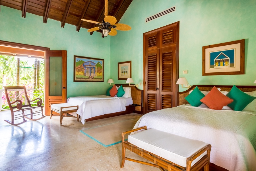 The other guest bedroom also has two double-sized beds.