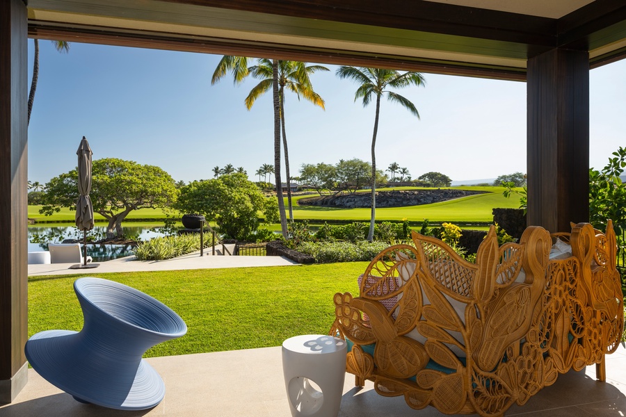 Primary Suite #2: Soak in stunning views from your lanai, where tropical palms frame the perfect Hawaiian paradise.