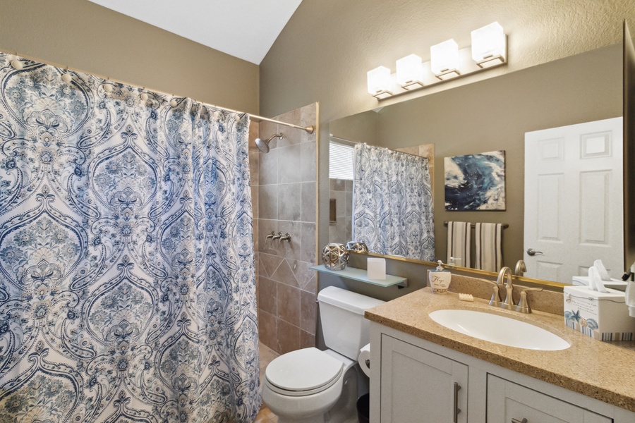 The updated guest bath with a tub/shower ensures that everyone stays refreshed and pampered throughout their stay