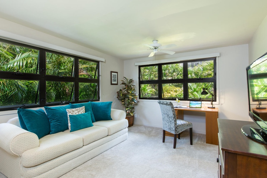 Extra living space featuring stunning garden vistas and a thoughtfully designed workspace for those inspired moments.