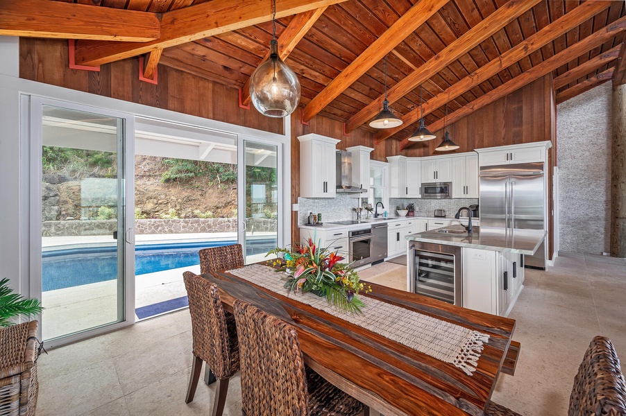 Dining and kitchen have pool views