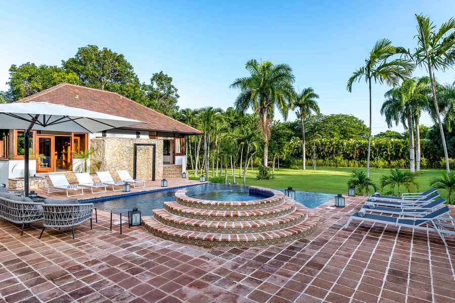 Lounge by the pool and experience the serene beauty of Dominican Republic.