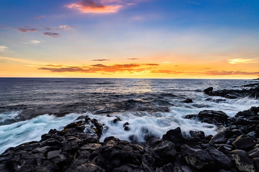 Watch the waves crash dramatically against the rugged lava rock shoreline.