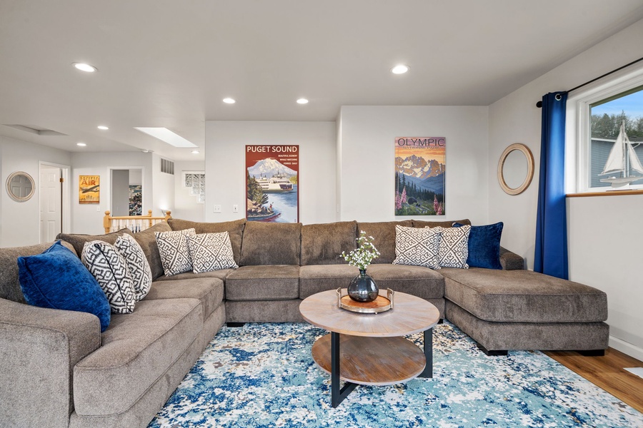Sink into plush seating with room to spread out. Blue accents and local artwork create your perfect gathering spot.