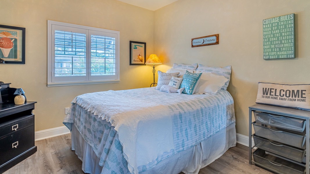 The second guest bedroom with a comfortable and restful queen bed.