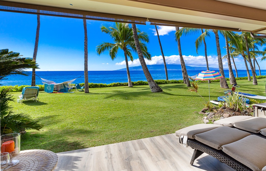 Relax and unwind on the covered lanai with breathtaking ocean and garden views.