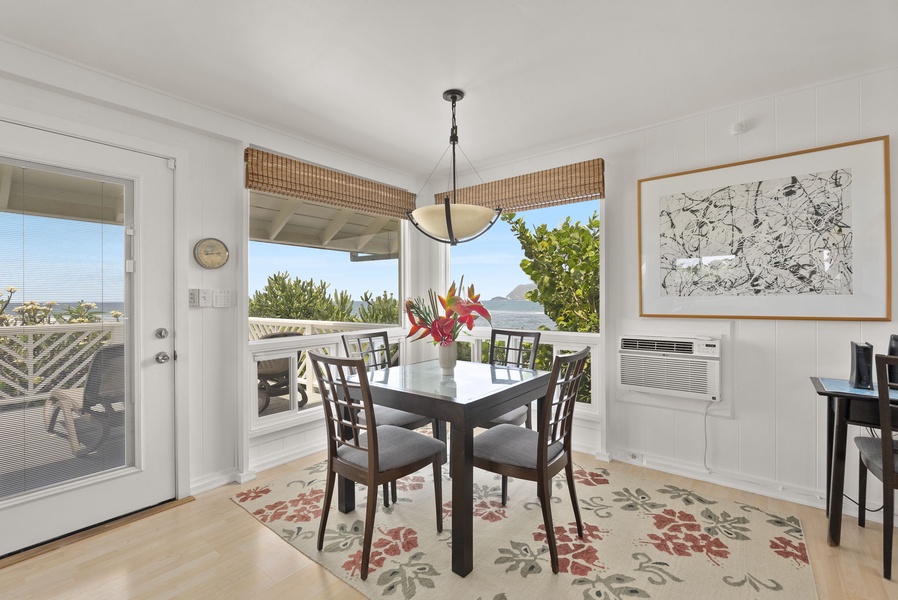 The bright cottage dining space opens to stunning ocean views, where morning coffee feels like a retreat.