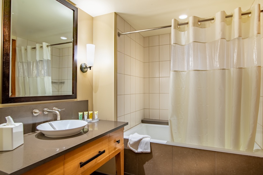 The second guest bathroom has a shower and tub combo.