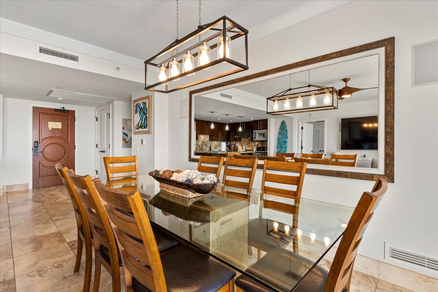 An elegant dining area with seating for eight at Honua Kai Hokulani 825—perfect for meals or entertaining.