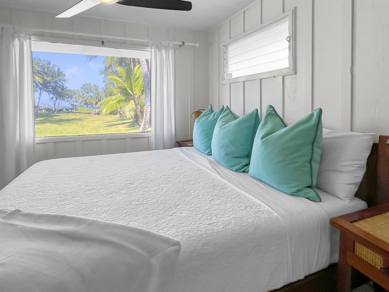 Guest Bedroom 3 has a king bed, ocean and garden views, split AC, and a ceiling fan