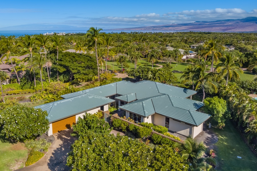 Bird's eye view of the estate, ocean and mountains in the background