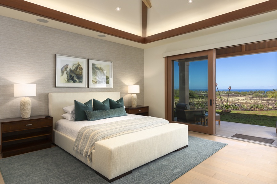 Stylish and luxury appointed primary suite with a king bed on top of the modern bed direct lanai access.