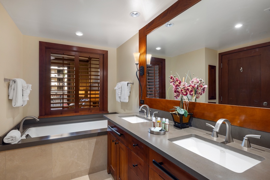 The primary guest bathroom featuring a luxurious soaking tub.