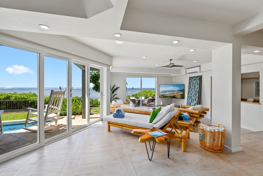 Indoor chaise loungers are also in the living area with ocean views.