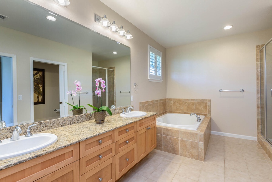 Unwind in the ensuite bath with a soaking tub and walk-in shower.