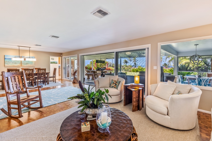 The thoughtfully designed floor plan features a family room, office, living room, and dining room, all gracefully interconnected by a multitude of alluring lanais