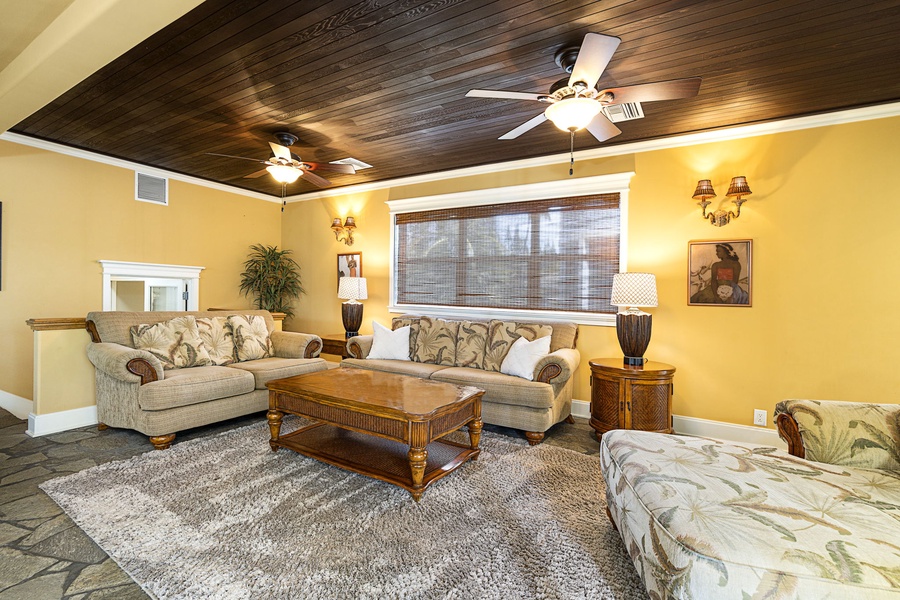 Media room features a plush sectional, central A/C, and ample seating for movie nights.
