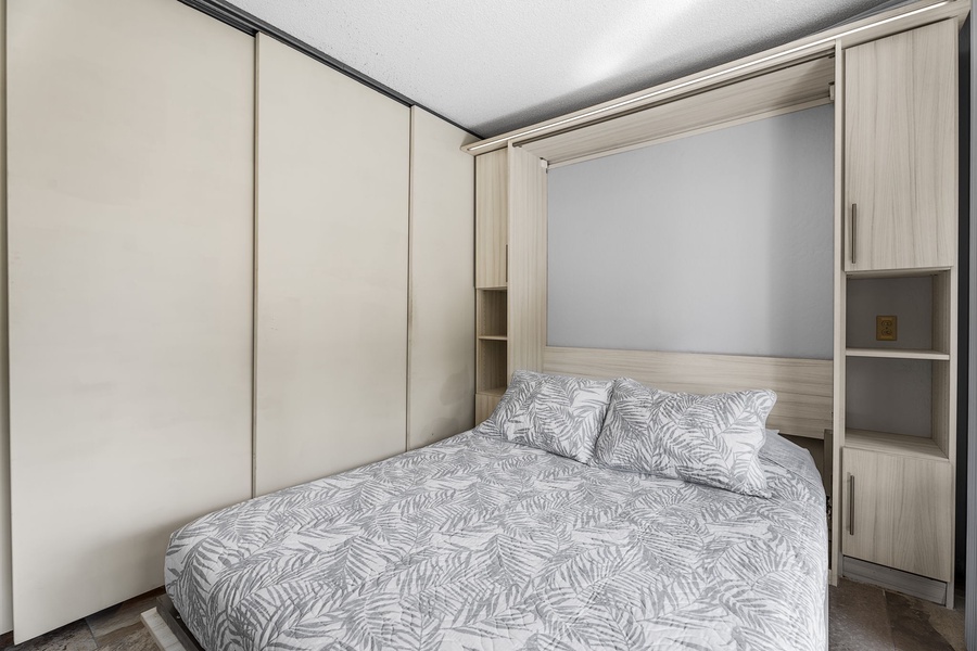 Stylish Murphy bed tucked into custom cabinetry for a clean look.