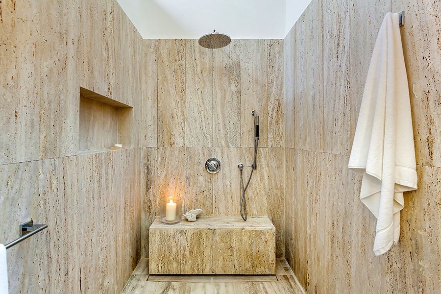 A luxurious stone shower offering a serene and spa-like experience.