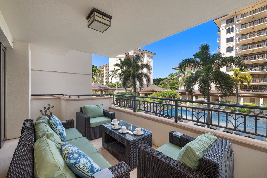 Another incredible view of the lanai surrounded by swaying palm trees.