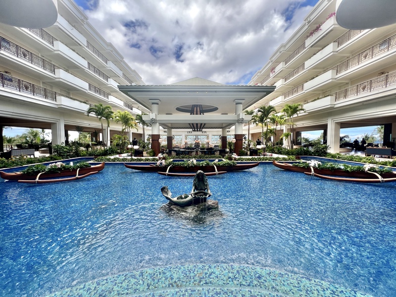 Experience luxury at the Grand Wailea Maui resort-style pool, complete with breathtaking views and lush surroundings.